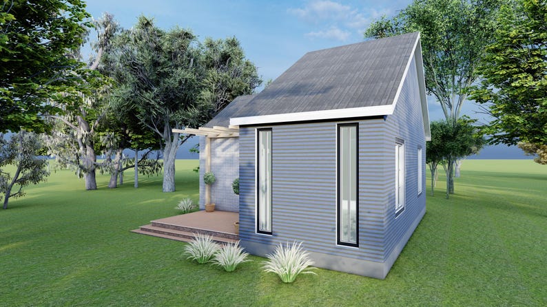 Peut inclure: Une maison moderne bleu-gris avec un toit en pente et de grandes fen&ecirc;tres. La maison est entour&eacute;e d'herbe verte et d'arbres, avec une petite terrasse en bois et une pergola. Le ciel est bleu avec des nuages.