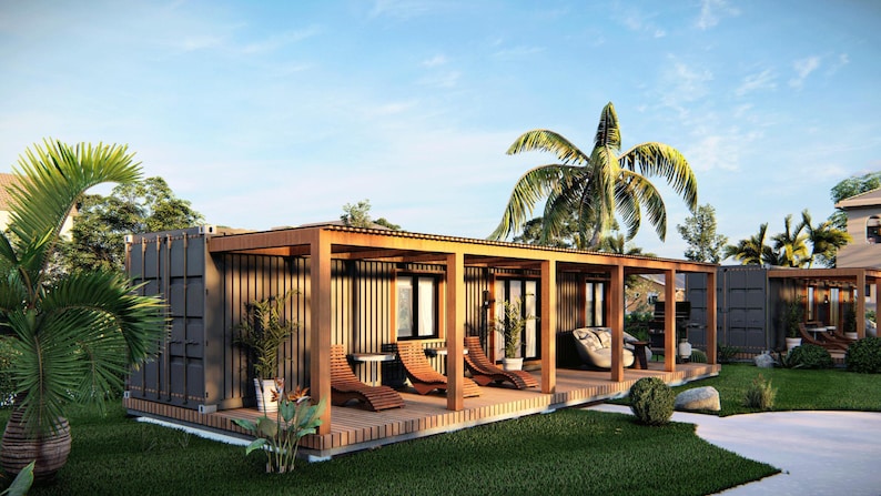May include: A modern, wooden cabin with a covered porch and lounge chairs. The cabin is surrounded by lush greenery and palm trees.