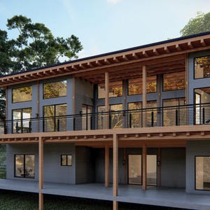 Puede incluir: Una casa moderna de dos pisos con una terraza de madera y grandes ventanas. La casa est&aacute; pintada de gris con vigas de madera y una barandilla negra.