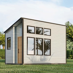 Puede incluir: Una pequeña casa moderna blanca con molduras marrones y ventanas grandes. La casa tiene un techo plano y un diseño simple.