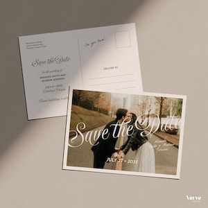 May include: Two-sided wedding Save the Date postcards. The front features a photo of a couple kissing with the text "Save the Date" and the date July 21, 2035. The back has the couple's names and address.