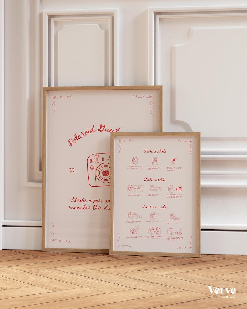 May include: Two framed prints with a light wood finish. The larger print reads "Polaroid Guest Book" with a camera illustration and the text "Strike a pose and help us remember this day forever!" The smaller print has photo instructions.