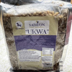 May include: A 1 kg bag of dried breadfruit, labeled "Sabifon Dried Breadfruit "Ukwa"". The bag is clear plastic and shows the product inside. The label has instructions on how to cook the breadfruit.