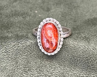 Sunstone Ring with a Twisted  Silver Border