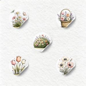 May include: Five circular stickers featuring watercolor-style illustrations of floral arrangements. Designs include daisies with butterflies, a woven basket of flowers, a rounded garden mound, pink and white tulips, and white and pink anemones.