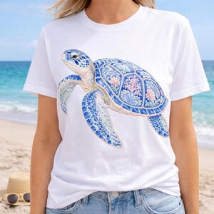 A collection of soft watercolor coastal elements, including a striped swimsuit, a bucket of seashells, nautical ropes, a lighthouse, a pelican, and a sand dollar arrangement, all rendered in serene blues, pinks, and white. This image captures the essence of a tranquil beach vacation.