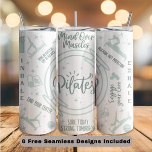 May include: Three white stainless steel tumblers with Pilates-themed designs. Each tumbler features text and illustrations in a light teal color. The text includes phrases like "Mind Over Muscles" and "Engage Your Core."