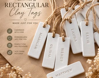 May include: A collection of white rectangular clay tags, each featuring an embossed name including Maricar, Olivia, Wendy, Laura, Ellie, and Matthew. Each tag is attached to a piece of brown jute twine. The text on the background reads HANDMADE RECTANGULAR Clay Tags MADE JUST FOR YOU.
