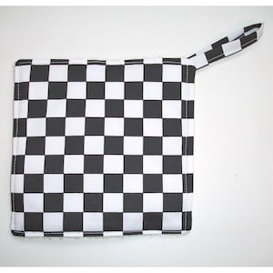 May include: Black and white checkered kitchen pot holder with a loop handle.