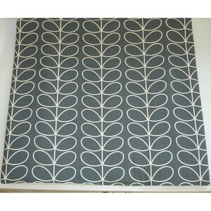 May include: Grey fabric with a white repeating pattern of stylised leaves.