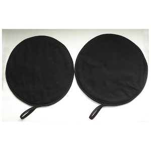 May include: Two black round car sunshades with a black strap.
