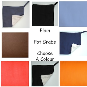 May include: A set of nine pot holders in various colors, including black, navy blue, brown, orange, red, and light blue. The pot holders are made of a soft, quilted fabric with a layer of heat-resistant material on the back. The text "Plain Pot Grabs Choose A Colour" is printed below the pot holders.