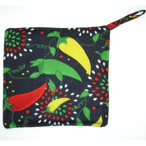 May include: A black pot holder with a colorful chili pepper pattern. The pot holder has a loop handle and is made of fabric.