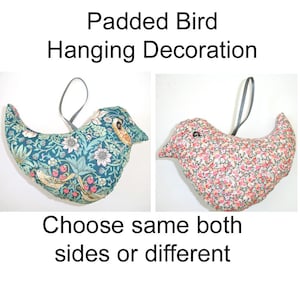 May include: Two padded bird hanging decorations with grey ribbon loops. The left bird features a teal fabric with a floral and strawberry pattern. The right bird features a pink and white floral print. Text reads: Padded Bird Hanging Decoration. Choose same both sides or different.