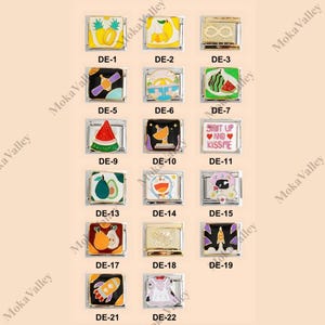 May include: A selection of gold-coloured charm links with vibrant enamel designs. The charms depict diverse images, such as fruits, a satellite, a rocket, and text that reads "SHUT UP AND KISSME". Each charm is labelled with a "DE-" number.
