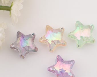 May include: Four iridescent star-shaped glass beads in shades of purple, green, pink, and yellow. The beads are faceted and have a rainbow-like sheen.