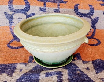 Planter with attached saucer