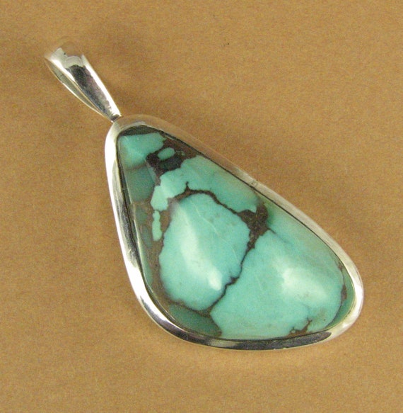 Turquoise stone pendant. Asymmetric. Blue, green.  Sterling silver 925.