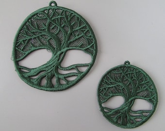 May include: Two green embroidered tree of life designs. The larger design is about 5 inches in diameter and the smaller design is about 3 inches in diameter.