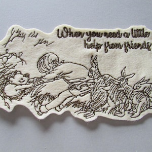 May include: Cream-colored felt applique with a whimsical illustration. A child is reaching for a teddy bear, surrounded by rabbits. The text "When you need a little help from friends" is embroidered above the scene.