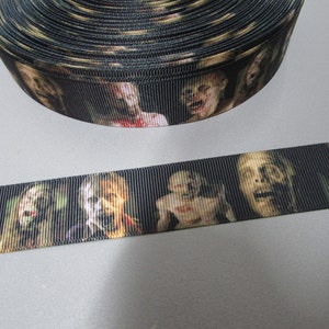 May include: Black and white ribbon with a repeating pattern of zombie faces. The ribbon is made of a soft, durable material and is perfect for adding a spooky touch to any craft project.