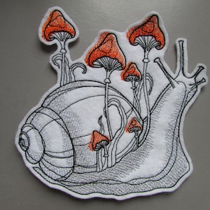 May include: Embroidered patch of a snail with a shell and a long, curled body. The snail is surrounded by orange mushrooms with white stems.