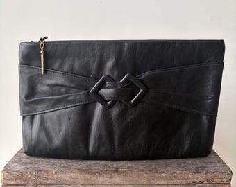 Vintage Clemente Black Leather Clutch: 1970s Minimalist Evening Bag with Bow Detail