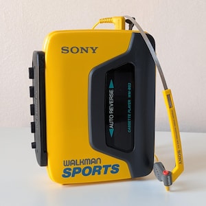 Sony Walkman Sports WM-B53 Vintage Yellow Cassette Player with Original MDR-W15 Headphones – Fully Working image 1