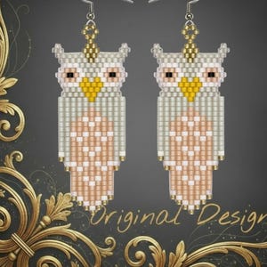 May include: A pair of beaded owl earrings. The earrings feature a light gray and peach color scheme with yellow accents. The owl design is detailed with small beads, and the earrings have silver-colored hooks.