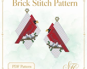 Puede incluir: Un patrón de punto ladrillo en PDF con dos diseños de cuentas en forma de diamante de cardenales rojos posados en ramas sobre un fondo blanco. El diseño incluye cuentas blancas, rojas, verdes y marrones con anillas de metal dorado.