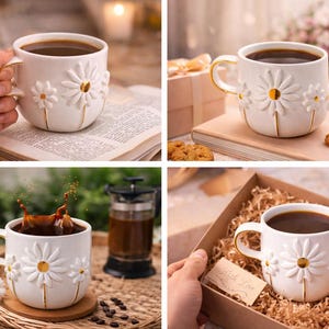 May include: A white ceramic mug featuring a raised, three-dimensional daisy design with gold-painted centers and stems. The mug has a gold-trimmed handle and is filled with dark coffee, showcasing a floral motif on the exterior surface.
