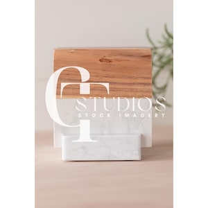 May include: A wooden and white marble display stand with the text "GT Studios Stock Imagery" on the front.