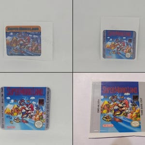 Pode incluir: Uma etiqueta retangular de cartucho de videogame Super Mario Land com uma ilustração colorida de Mario em um veículo, com o título em vermelho e azul, o logotipo da Nintendo e o código do modelo DMG-ML-USA impresso na borda lateral.
