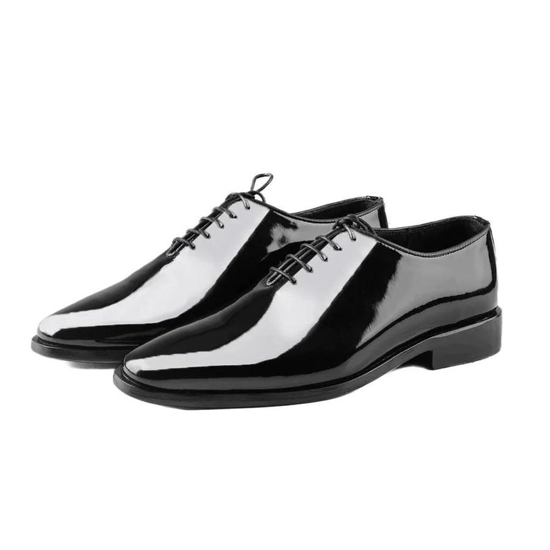 May include: A pair of black leather lace-up shoes with a polished finish.