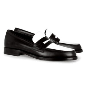 May include: Black leather loafers with a white leather panel across the toe and a white leather strap across the vamp.