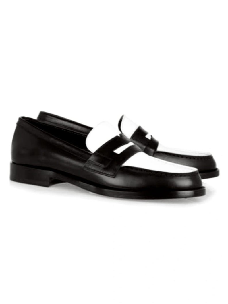 May include: Black leather loafers with a white leather panel across the toe and a white leather strap across the vamp.