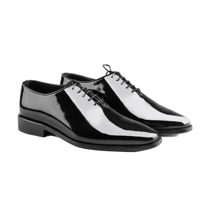 May include: A pair of black leather lace-up shoes with a polished finish.