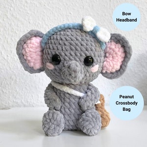 May include: Gray crocheted elephant plush toy with pink ears, a blue bow headband, and a brown peanut crossbody bag.