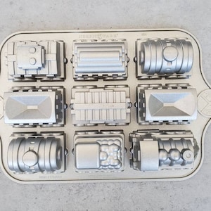 Nordic Ware Train Cake Pan -  Metal Baking Pan Muffins, 5 cups Cupcakes, Ornate Cake Pan