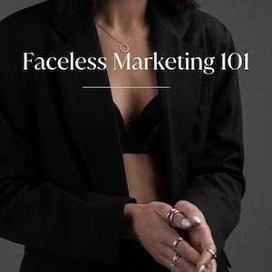 May include: A woman wearing a black blazer and a black bra, with a silver necklace and multiple silver rings on her fingers. The text "Faceless Marketing 101" is written in white letters on a black background.