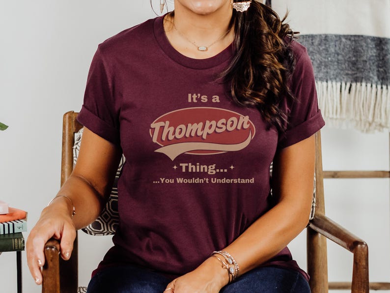 May include: A maroon t-shirt with a vintage-style graphic that reads "It's a Thompson Thing... You Wouldn't Understand".
