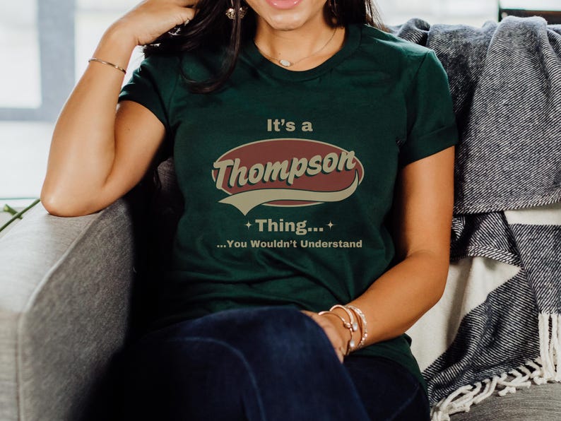 May include: A green t-shirt with a vintage-style logo that says "It's a Thompson Thing... You Wouldn't Understand".