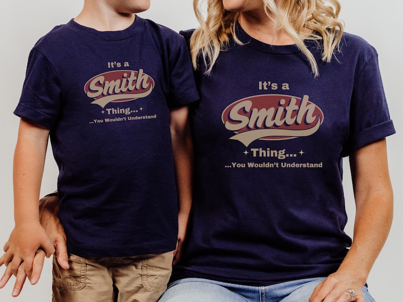 May include: Two navy blue t-shirts with a vintage-style graphic that says "It's a Smith Thing... You Wouldn't Understand".