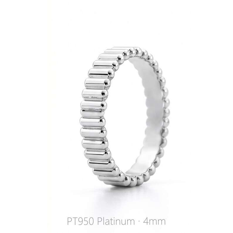 Side view of a 4mm PT950 platinum band ring with ribbed texture, showing consistent width and polished finish