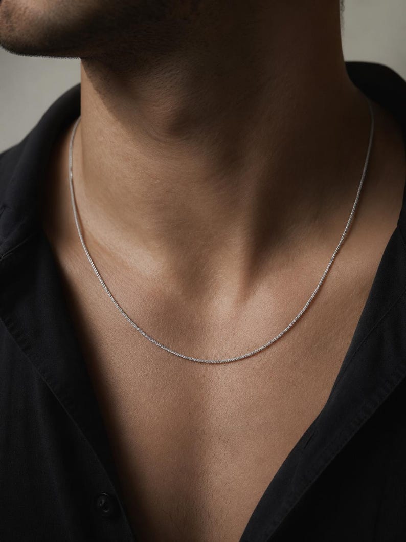 slim platinum chain necklace 1.4mm worn on chest with open shirt minimal unisex styling
