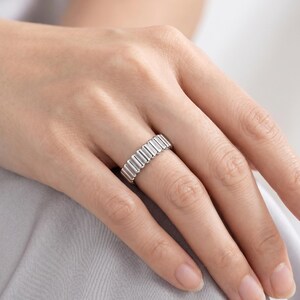 Textured platinum band ring worn casually on a hand, showing how the 4mm band sits during daily wear