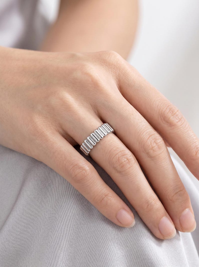 Textured platinum band ring worn casually on a hand, showing how the 4mm band sits during daily wear