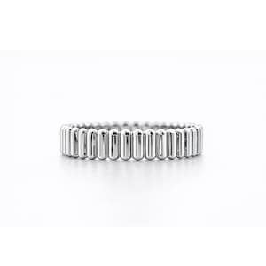 PT950 platinum ribbed band ring on a white background, showing a 4mm wide linear textured design with polished finish