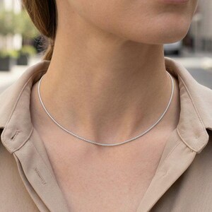 1.2mm platinum wheat chain necklace worn at collarbone, minimal everyday chain styling
