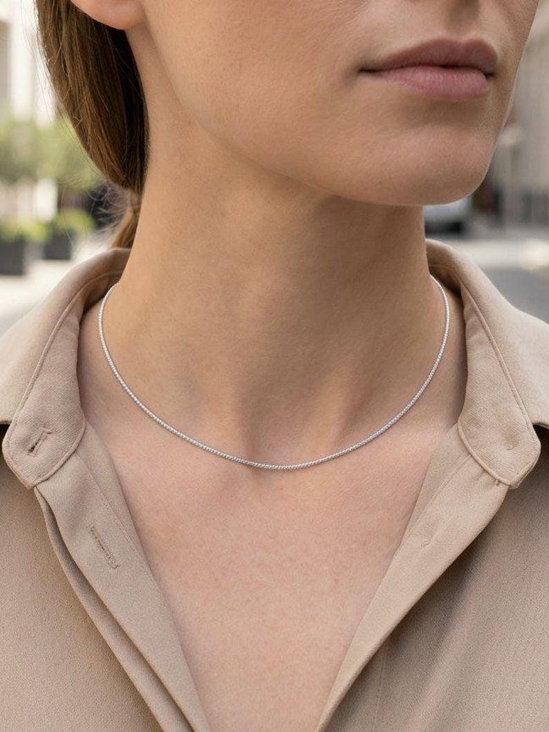 1.2mm platinum wheat chain necklace worn at collarbone, minimal everyday chain styling